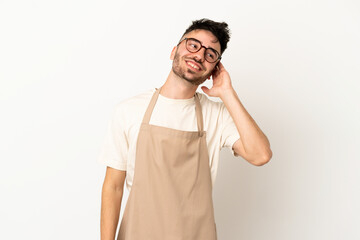 Fototapeta premium Restaurant waiter caucasian man isolated on white background thinking an idea