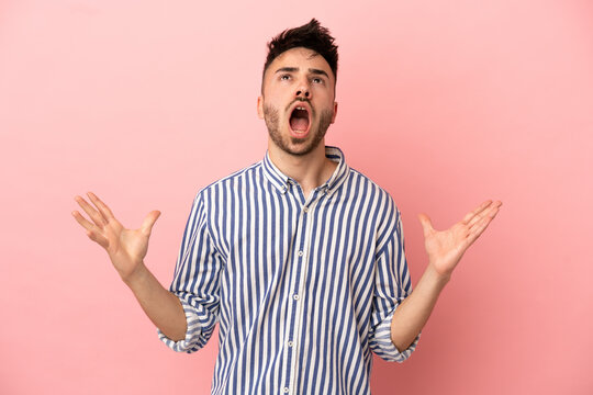 Young caucasian man isolated on pink background stressed overwhelmed - Powered by Adobe