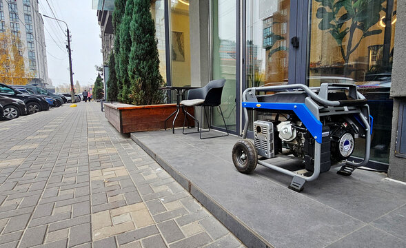 Power supply generator placed on street sidewalk. outdoor diesel power generator in Ukraine.