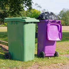 Wheelie bins in row for refuge collection outdoors