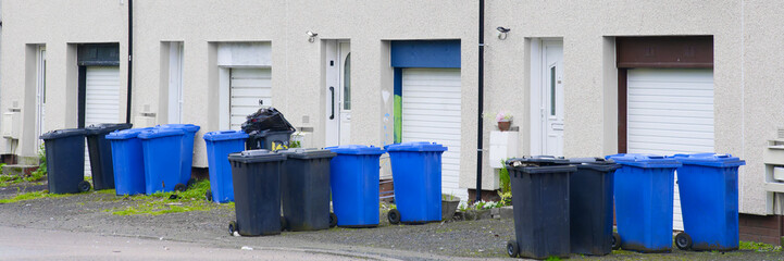Wheelie bins in row for refuge collection outdoors