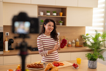 Woman food blogger filming making healthy breakfast vlog