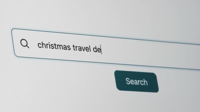 Christmas Travel Destinations Search on Search Engine. Close Up Shot of Typing Search Term in Search Box on Web Page on Computer Screen. Real Time 4K.