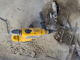 Electric Jackhammer Breaking Concrete with Rebar