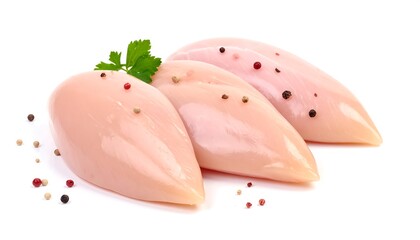 Three raw chicken breasts with parsley sprig, peppercorns on a white background