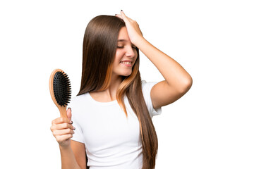 Teenager caucasian girl with hair comb over isolated background has realized something and...