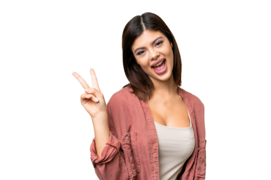Young Russian woman over isolated chroma key background smiling and showing victory sign - Powered by Adobe