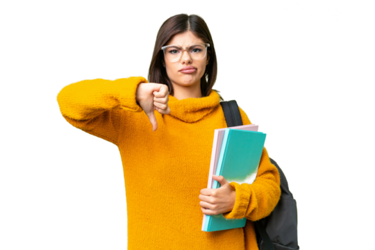 Young student woman over isolated chroma key background showing thumb down with negative expression