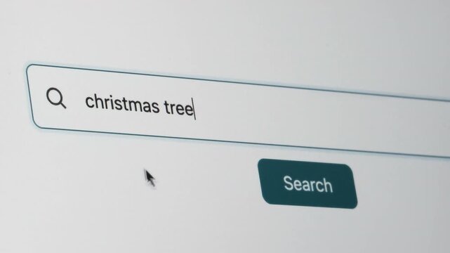 Christmas Tree Search on Search Engine. Close Up Shot of Typing Search Term in Search Box on Web Page on Computer Screen. Real Time 4K.