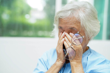 Asian senior woman wearing eyeglasses or vision glasses at home care service.