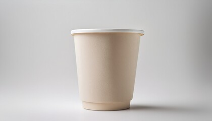 Beige Disposable Paper Cup Simple And Plain A Single Round Short Cup Light Beige Color Against A Plain White Background Made Of A Sturdy Paper Material