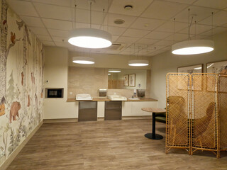 Wroclaw, Poland 09 24 2025: Modern interior design of a public restroom for mother and baby in shopping mall. Mother and child room