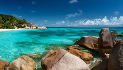 Granite Rocks And Turquoise Water In A Tropical Beach