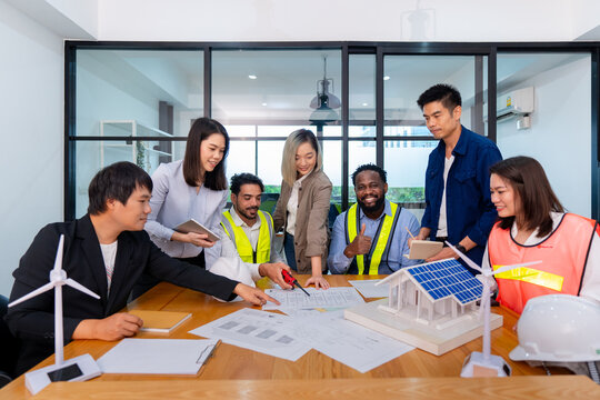 team of multiethnic colleague discuss budget performance planning, sharing idea for cost reduction, business people man woman diverse employee coworker in formal suit meeting in finance office