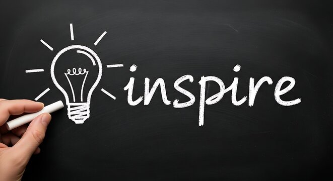 A hand drawing a light bulb and the word inspire on a chalkboard with chalk - Powered by Adobe