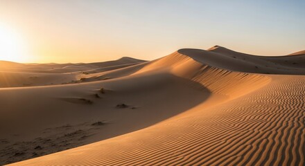 Serene desert landscape with flowing sand dunes illuminated by the warm light of a beautiful sunset