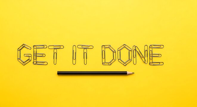 Get It Done Text Formed by Paperclips with Pencil on Yellow Background motivation productivity