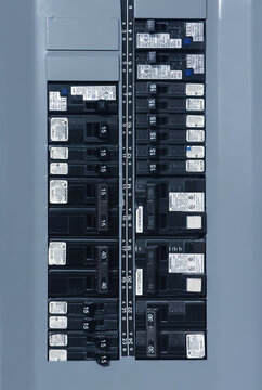 Calgary, Alberta, Canada. Nov 9, 2025. Electrical breaker panel showing two columns of labeled circuit breakers with amperage ratings and a numbered circuit position strip.
