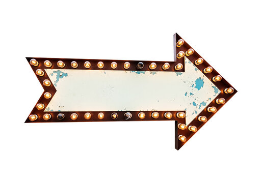 Retro arrow sign with blank space for text, illuminated by vintage bulbs, suggesting direction and vintage motel decor