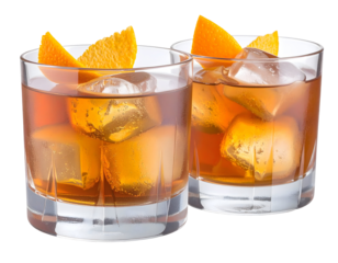 Two glasses of refreshing amber-colored beverage with ice cubes and orange slices garnishing each glass