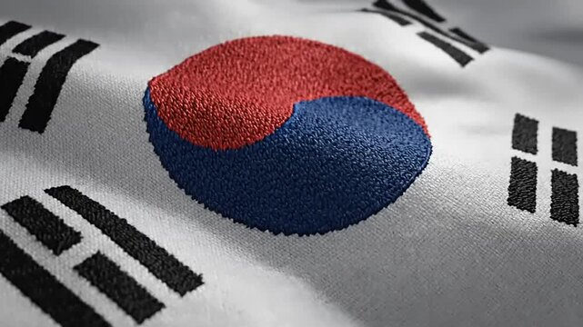 Close up Macro of South Korean Flag Fabric Texture with Taegeuk Symbol Waving