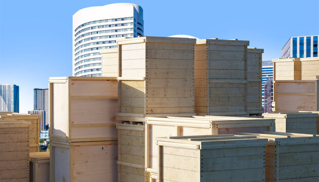 Export logistics organize wooden shipping crates stacked near city warehouses. Packaging and freight preparation for industrial and commercial goods. - Powered by Adobe