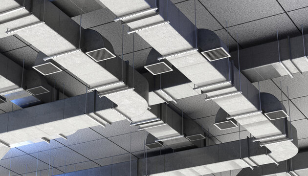 HVAC system installation in a commercial building. Air ducts and vents mounted under the ceiling provide ventilation, heating, and cooling for efficient air circulation.