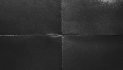 The texture of crumpled monochrome paper with the effect of noise, creases and unevenness.