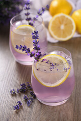 Summer homemade lemonade with lavender syrup, lemon juice and sparkling water with lavender sprigs