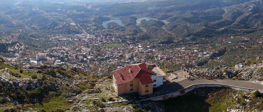 Panoramic aerial view from Sari Salltik viewpoint overlooking the historic city of Krujë and surrounding green valleys.