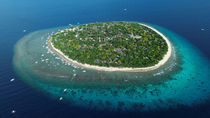 Tropical island with turquoise water and coral reef