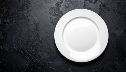 White plate on dark stone background conveying minimalistic elegance and conceptual lifestyle themes clean presentation.