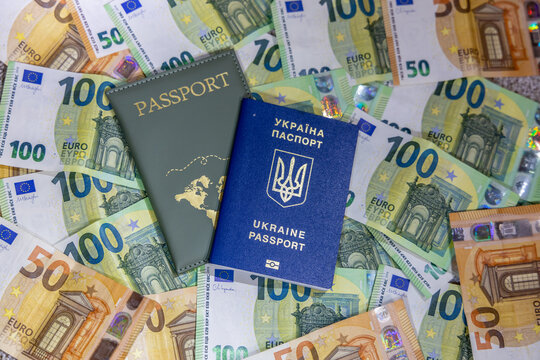 Passport of Ukraine and money Euro banknotes. Currency details and travel document representing tourism, finance, global travel expenses, international economy, cost worldwide journey concept