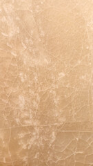 Texture of a plain light cream stone or wall surface.