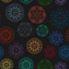 Seamless pattern of bright mandalas on a black background