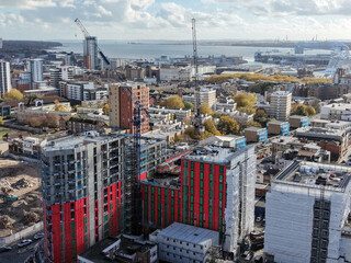 A construction site dominated by cranes , emphasizing growth and the evolution of the urban landscape in modern cities in London UK