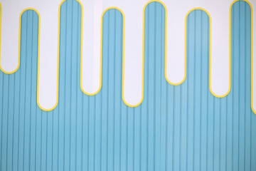 Modern vibrant blue wall with white and yellow accents for creative projects