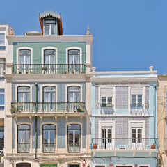 Obraz premium Facades of traditional portuguese houses decorated with azulejos tiles in Lisbon, Portugal 