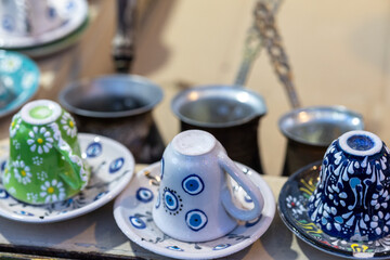 Close-Up of Turkish Coffee Cups with Nazar Charms
