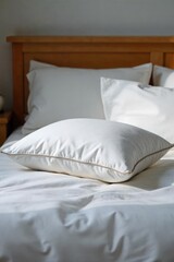 Soft, fluffy pillow nestled on a plush, inviting bed, ready for a restful night's sleep Perfect for relaxation and comfort themes , closeup, home