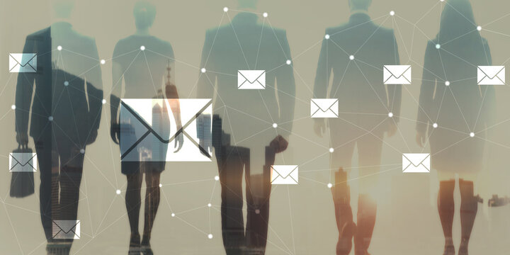 Businesswomen communicating through digital email network in modern office