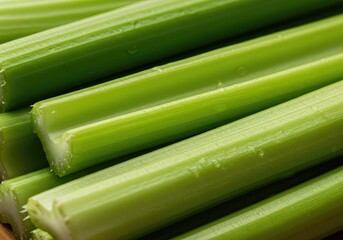 Fototapeta premium A vibrant close-up of fresh, raw green celery stalks being prepared for a healthy snack, emphasizing the crisp texture and appealing natural fiber ,preparation ,delicious ,ingredient