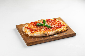 Classic margherita pizza with tomato sauce, melted cheese, and fresh basil served on wooden board over white background