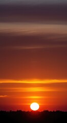 Fototapeta premium Brilliant dawn colors paint the eastern sky as the fiery sun crests the horizon, signaling a serene and hopeful new beginning ,horizon ,tranquil ,outdoors