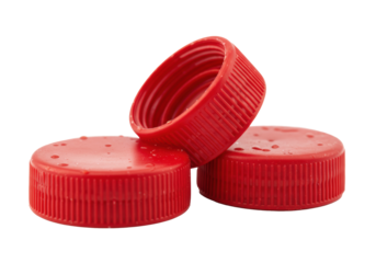 Extreme macro close-up of three hyper-detailed, scuffed red hdpe bottle caps revealing screw threads on a transparent background, concept of recycling and plastic waste awareness