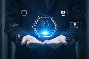 Creative technology concept with AI icon in light bulb and multimedia symbols on businessman’s hand. Represents artificial intelligence in content creation, digital innovation, and smart media tools.
