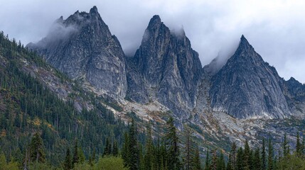 Rugged mountain peaks shrouded in mist