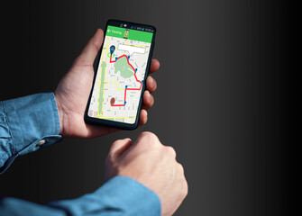 Person holding smartphone using GPS tracking application
