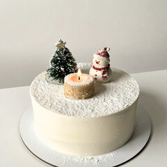 White Christmas Cake with Snowman and Miniature Tree Decorations