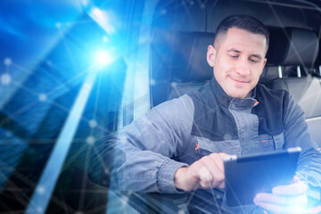 Logistics driver uses a digital tablet to manage deliveries and track transport routes, improving...